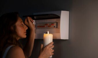 side-view-woman-checking-electrical-panel